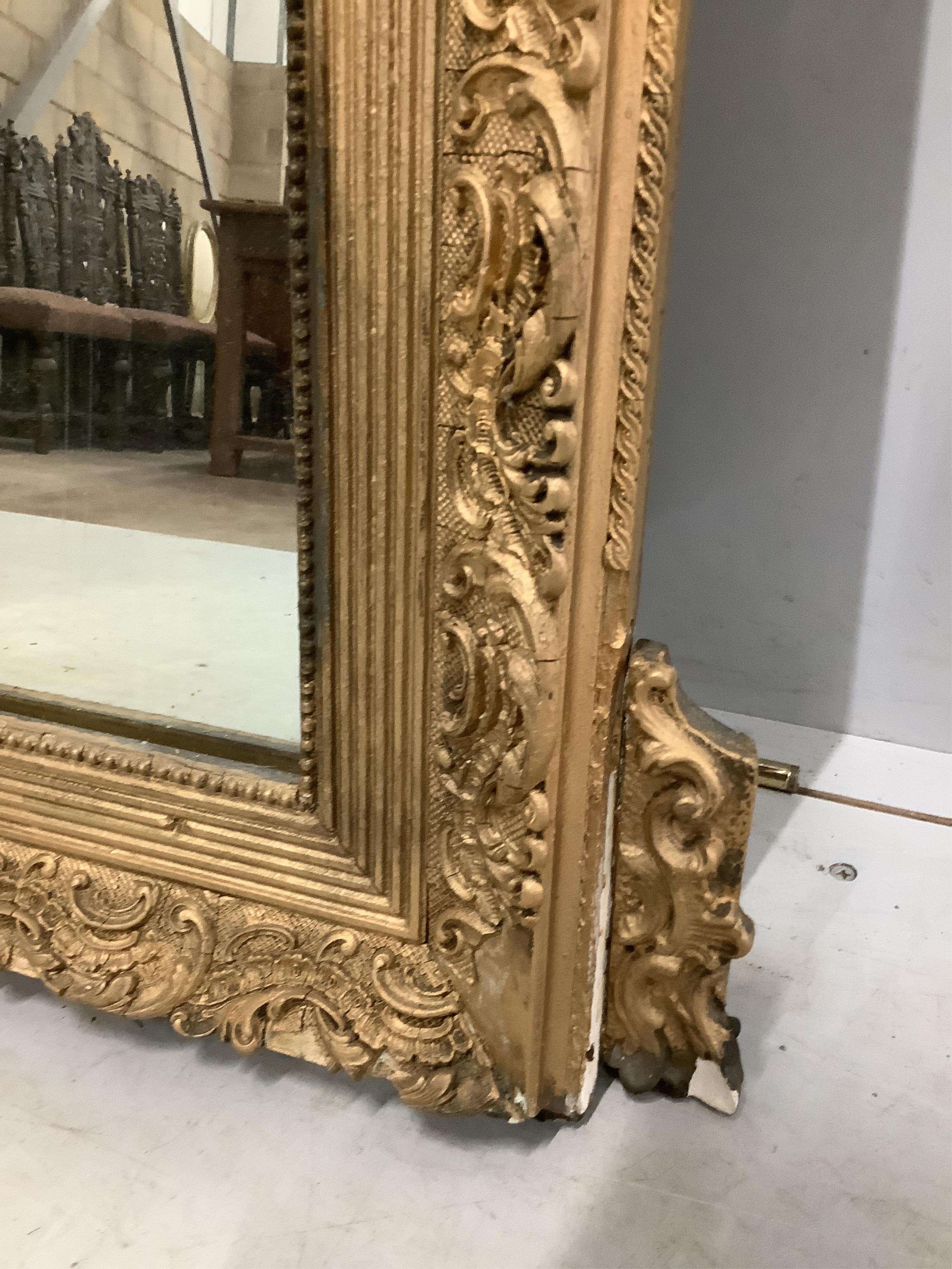 A 19th century French giltwood and composition wall mirror, width 84cm, height 131cm. Condition - poor to fair